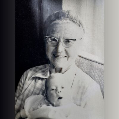 Elderly woman holding baby